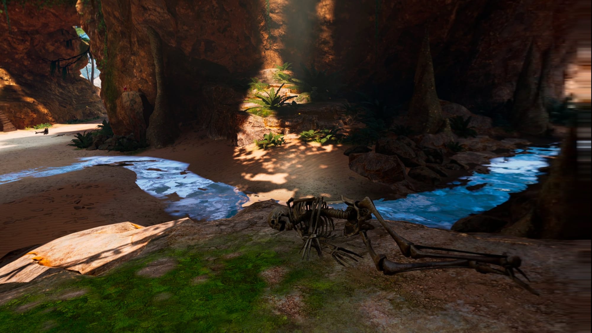 A skeleton on the ground near a stream of water